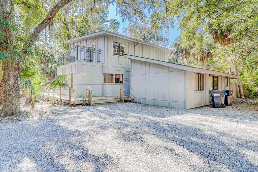 Dog friendly home with an enclosed yard, pool deck, & private pool