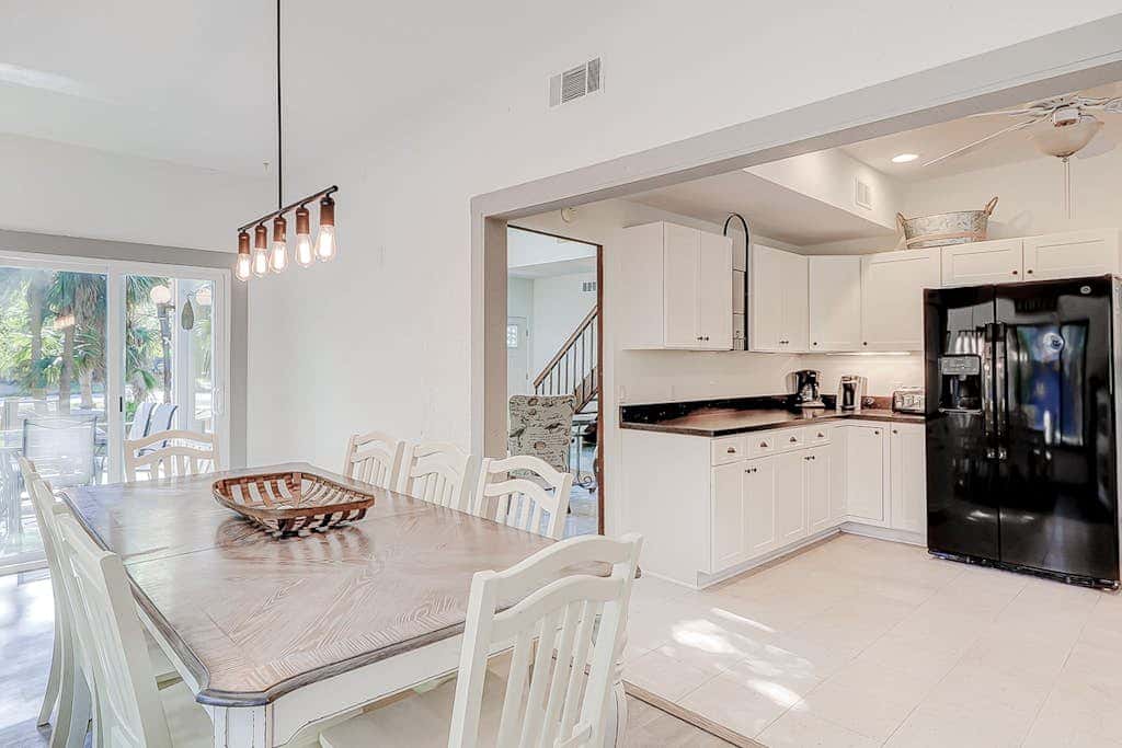 Dog friendly home with an enclosed yard, pool deck, & private pool