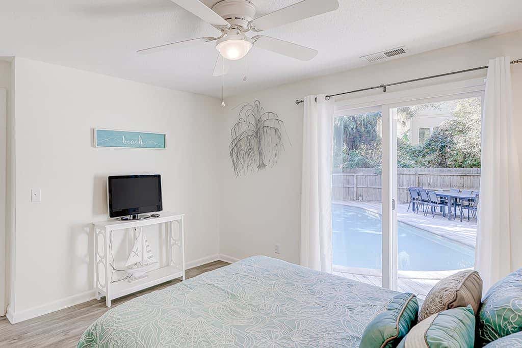 Dog friendly home with an enclosed yard, pool deck, & private pool