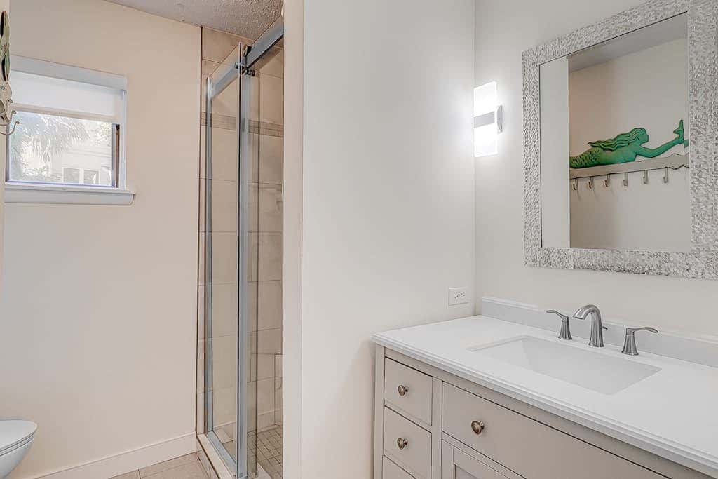 Dog friendly home with an enclosed yard, pool deck, & private pool