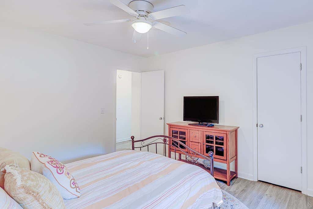 Dog friendly home with an enclosed yard, pool deck, & private pool