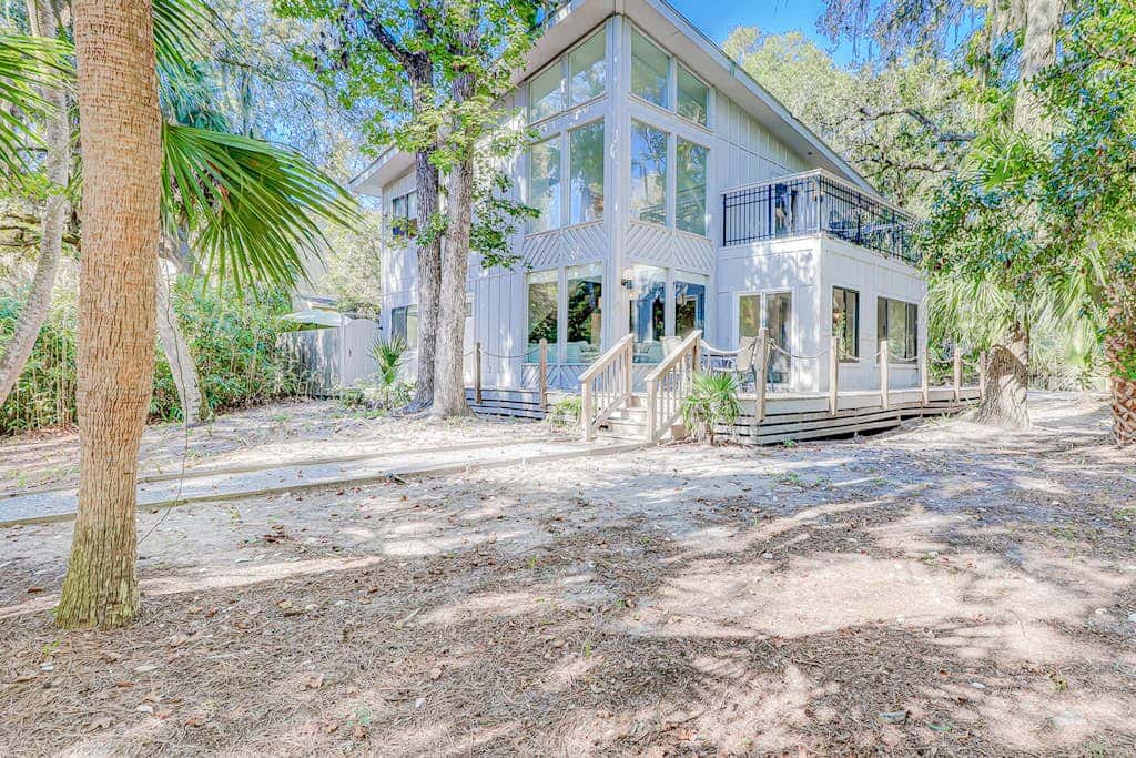 Dog friendly home with an enclosed yard, pool deck, & private pool