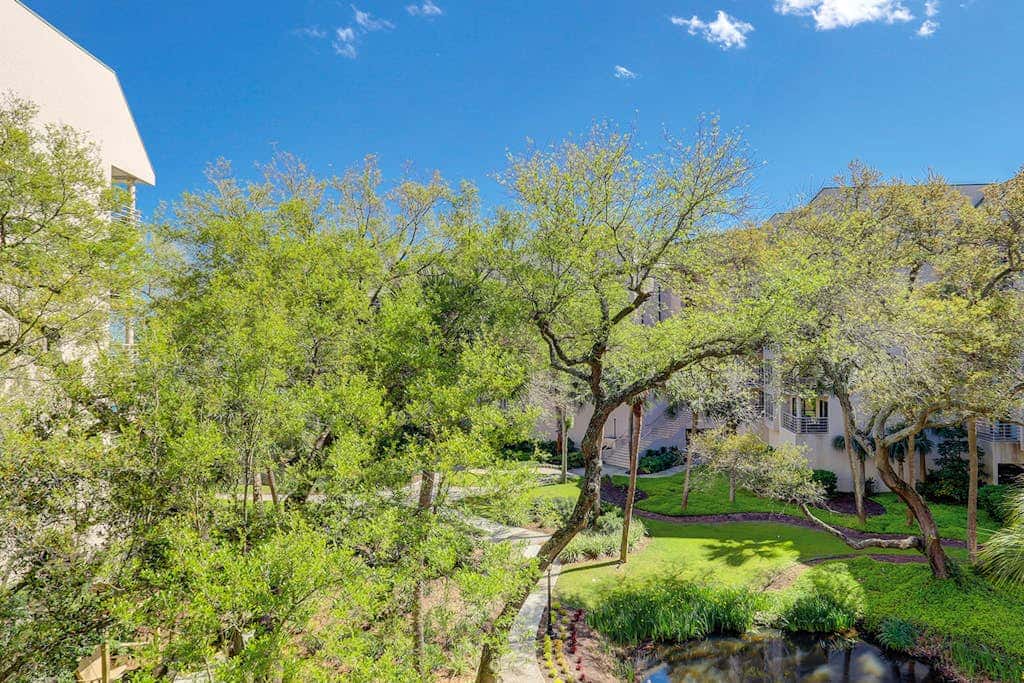 Island condo with beach access and balcony view  close to golf