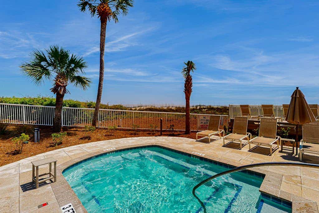 Sunny condo with ocean view balcony & beach access