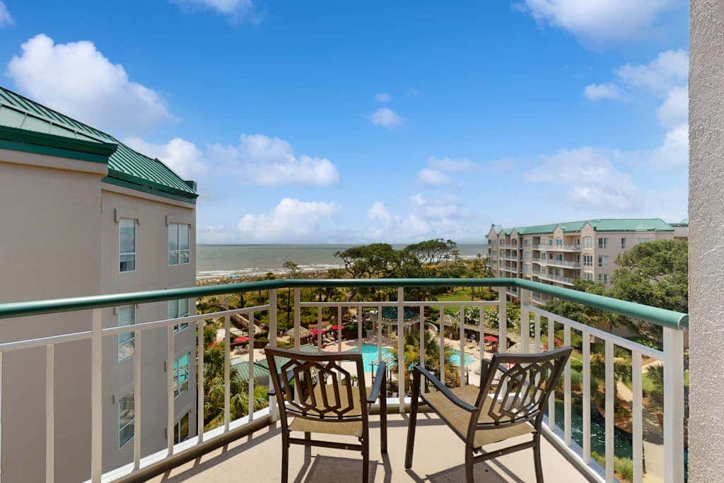 Island getaway by the ocean with balcony view & shared pool and beach access
