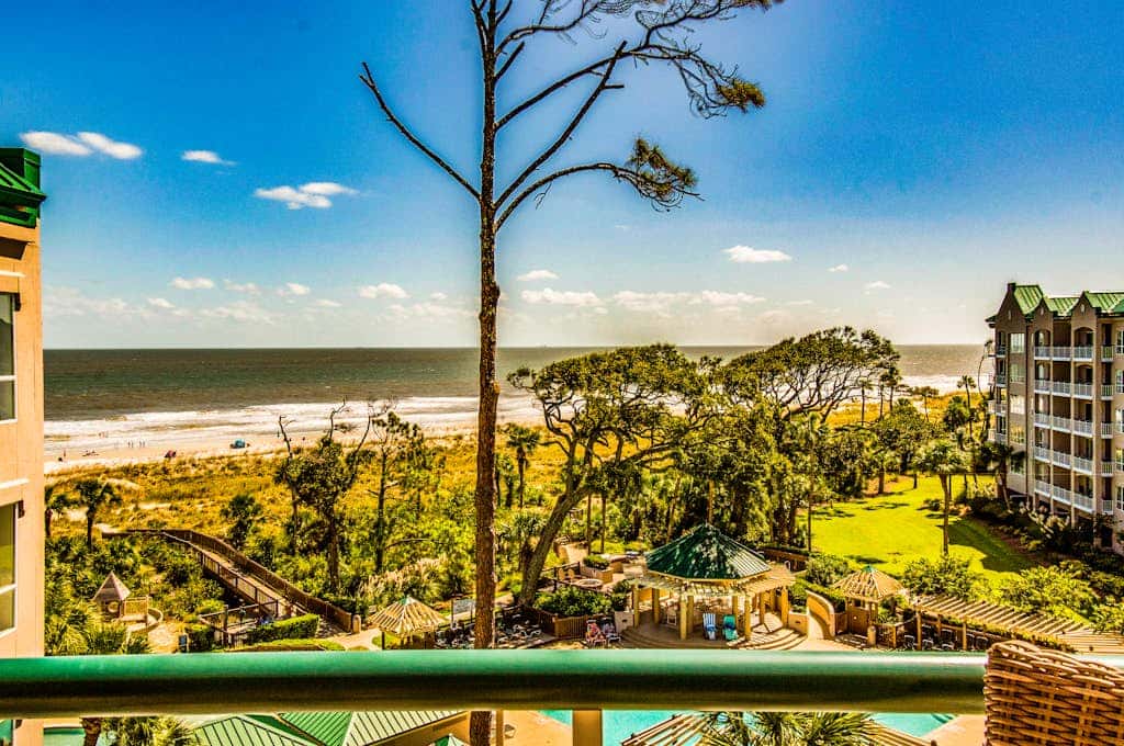 Island getaway by the ocean with balcony view & shared pool and beach access