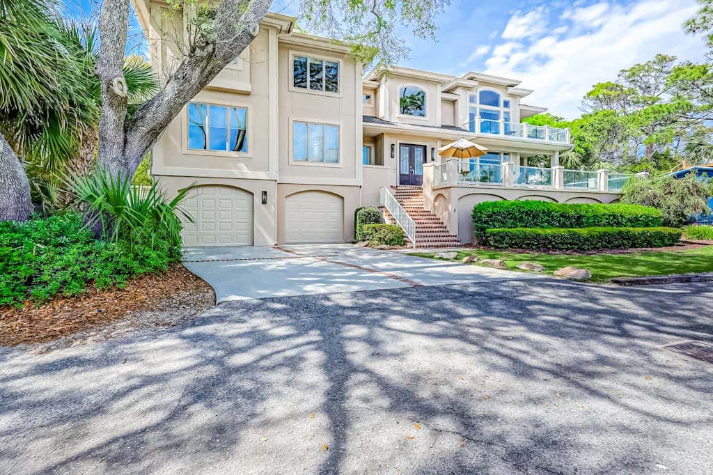 Prime location w/ private pool, elevator, game room and upper level water view 
