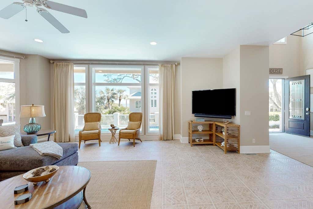 Prime location w/ private pool, elevator, game room and upper level water view 