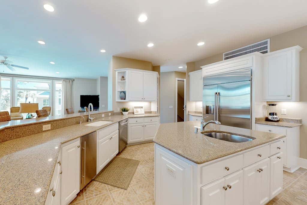 Prime location w/ private pool, elevator, game room and upper level water view 
