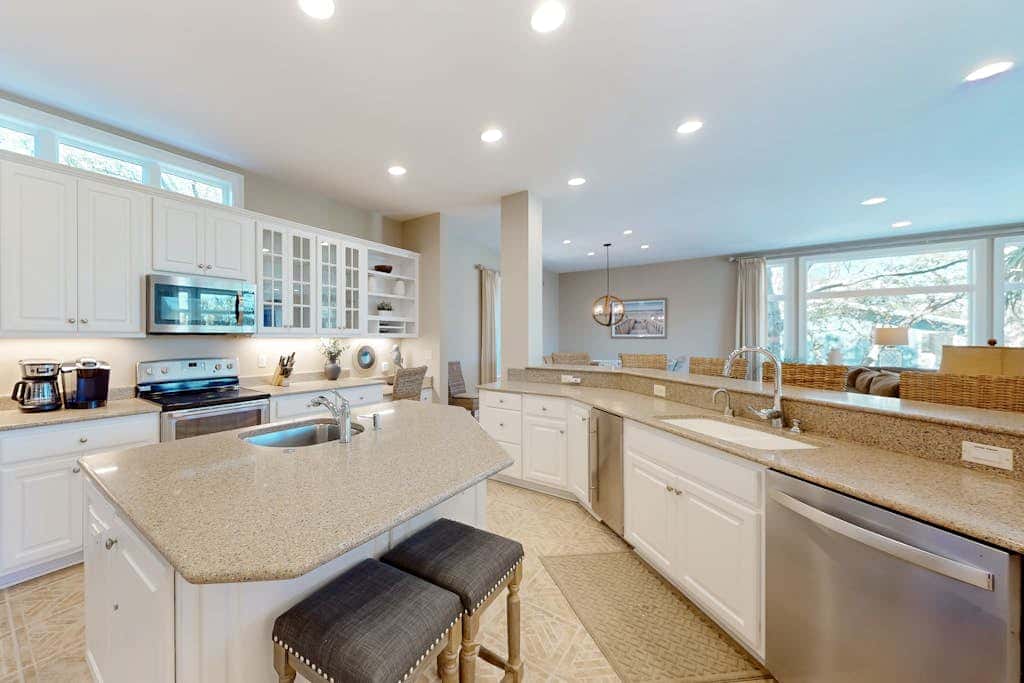 Prime location w/ private pool, elevator, game room and upper level water view 