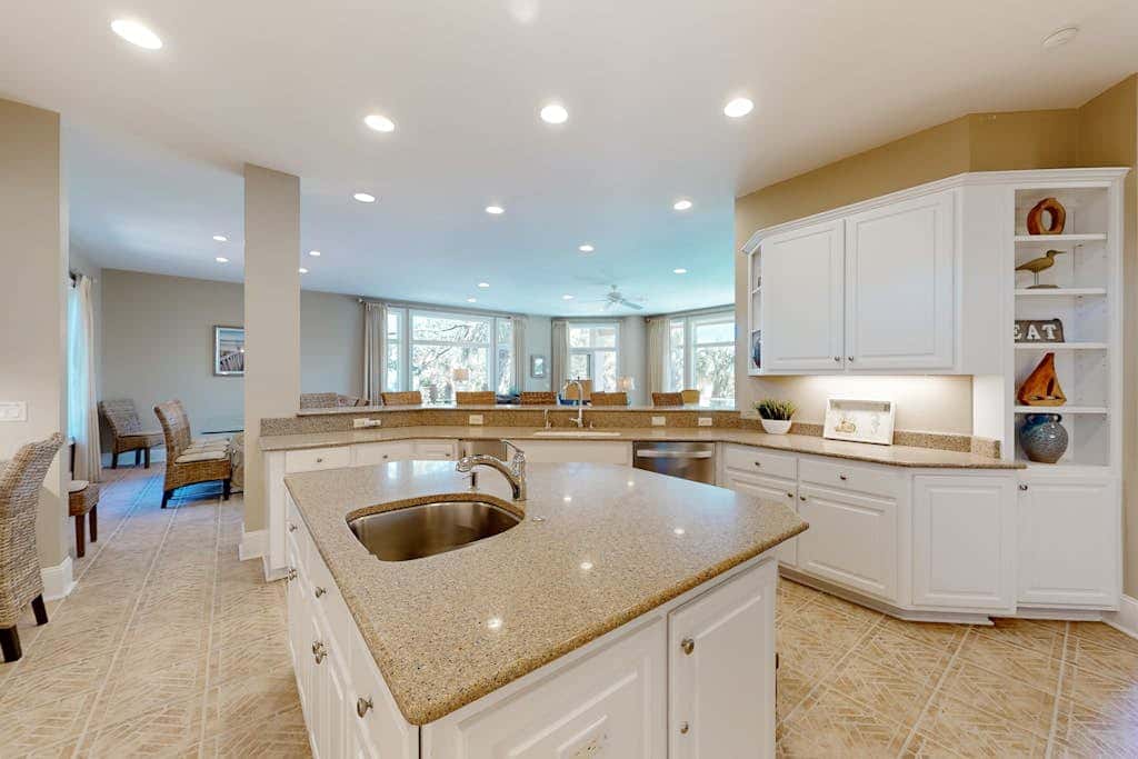 Prime location w/ private pool, elevator, game room and upper level water view 