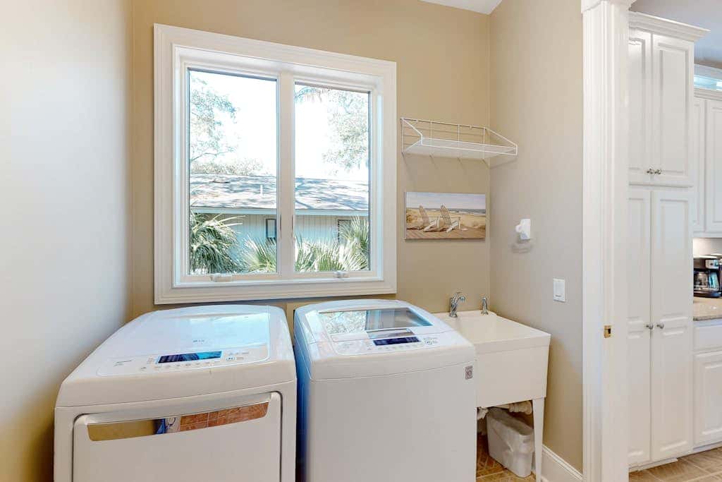 Prime location w/ private pool, elevator, game room and upper level water view 