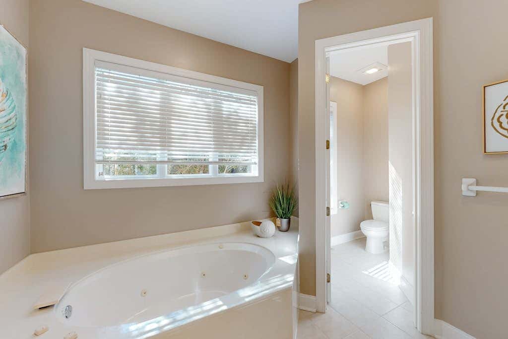 Prime location w/ private pool, elevator, game room and upper level water view 