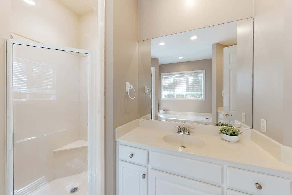 Prime location w/ private pool, elevator, game room and upper level water view 