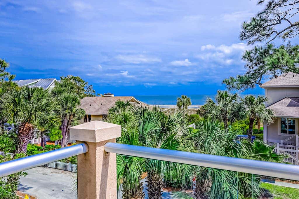 Prime location w/ private pool, elevator, game room and upper level water view 