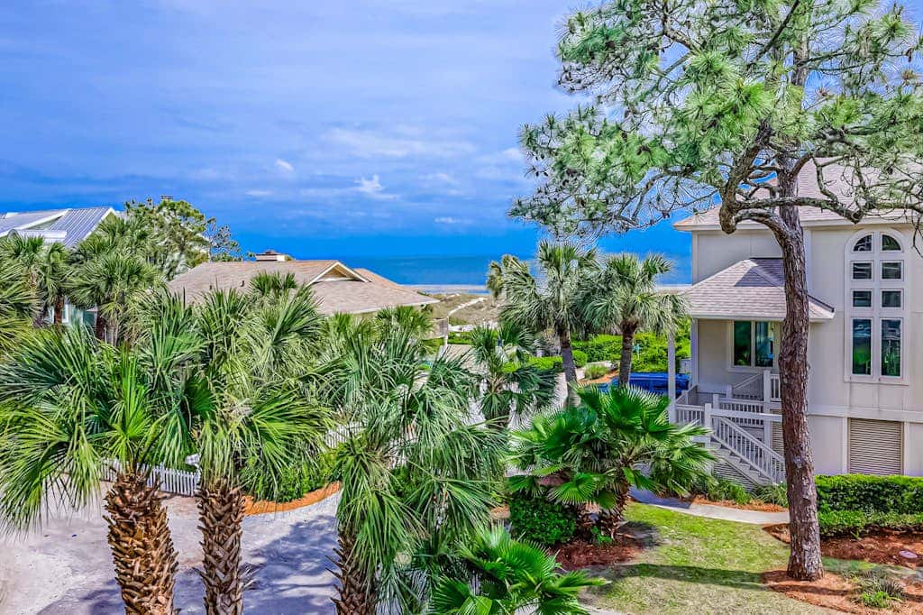 Prime location w/ private pool, elevator, game room and upper level water view 