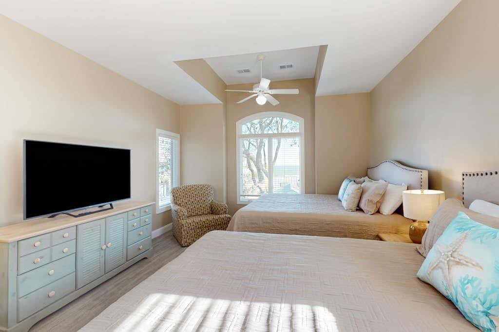 Prime location w/ private pool, elevator, game room and upper level water view 