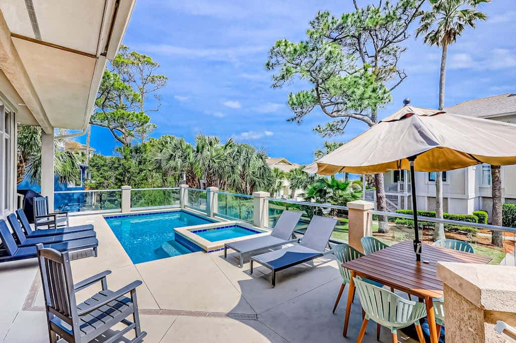 Prime location w/ private pool, elevator, game room and upper level water view 