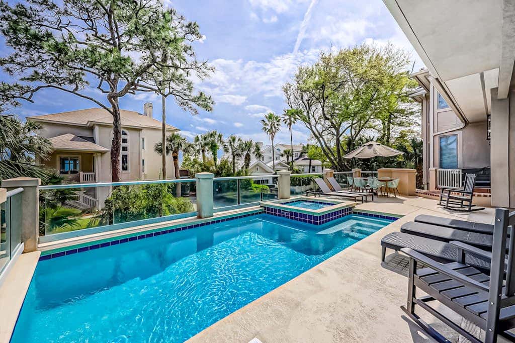 Prime location w/ private pool, elevator, game room and upper level water view 