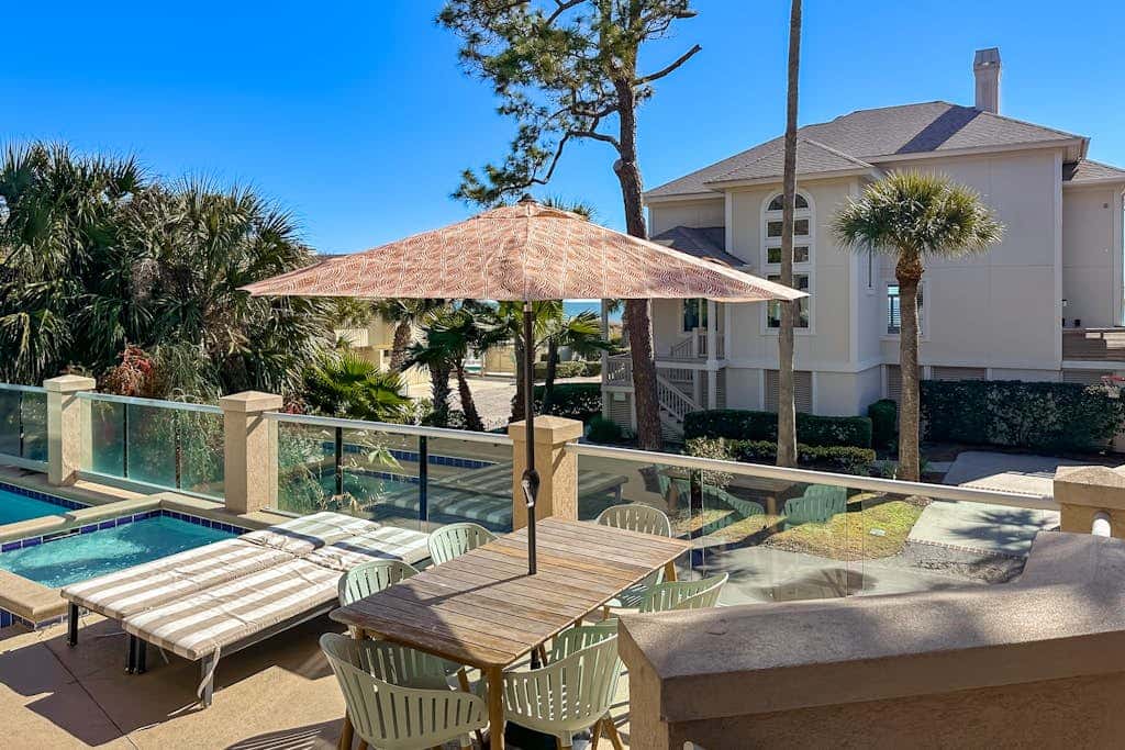 Prime location w/ private pool, elevator, game room and upper level water view 