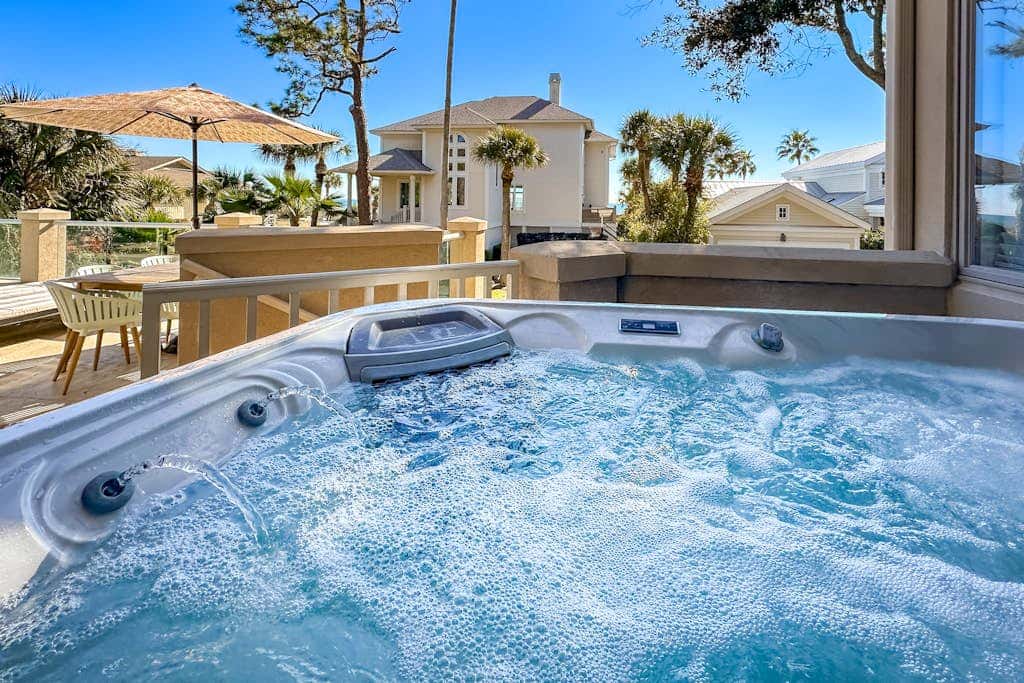 Prime location w/ private pool, elevator, game room and upper level water view 