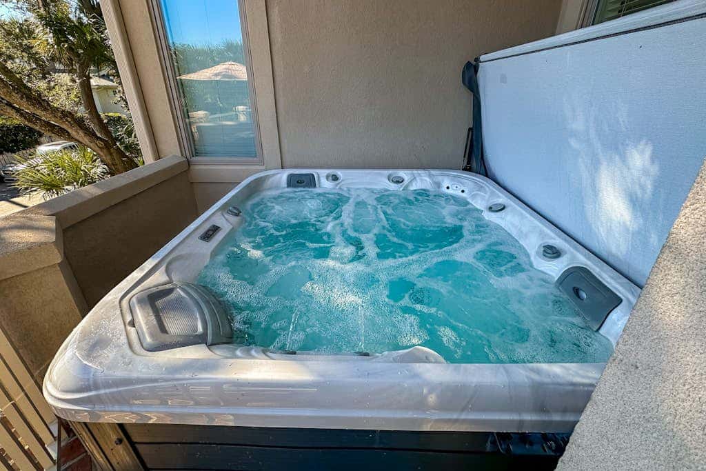 Prime location w/ private pool, elevator, game room and upper level water view 