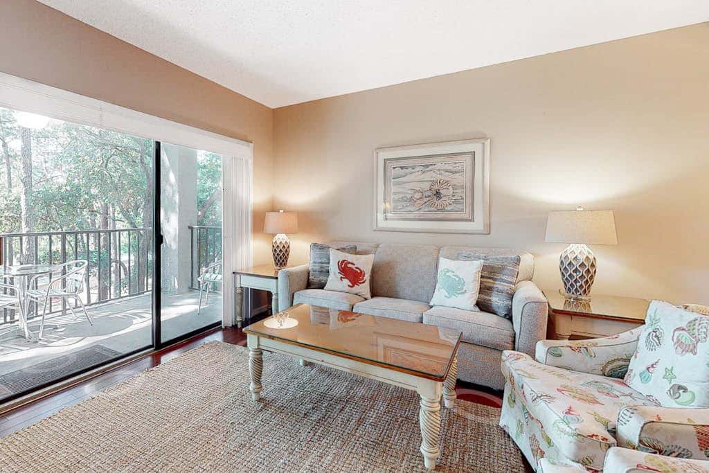 Second-floor condo with balcony, shared outdoor pool, central AC
