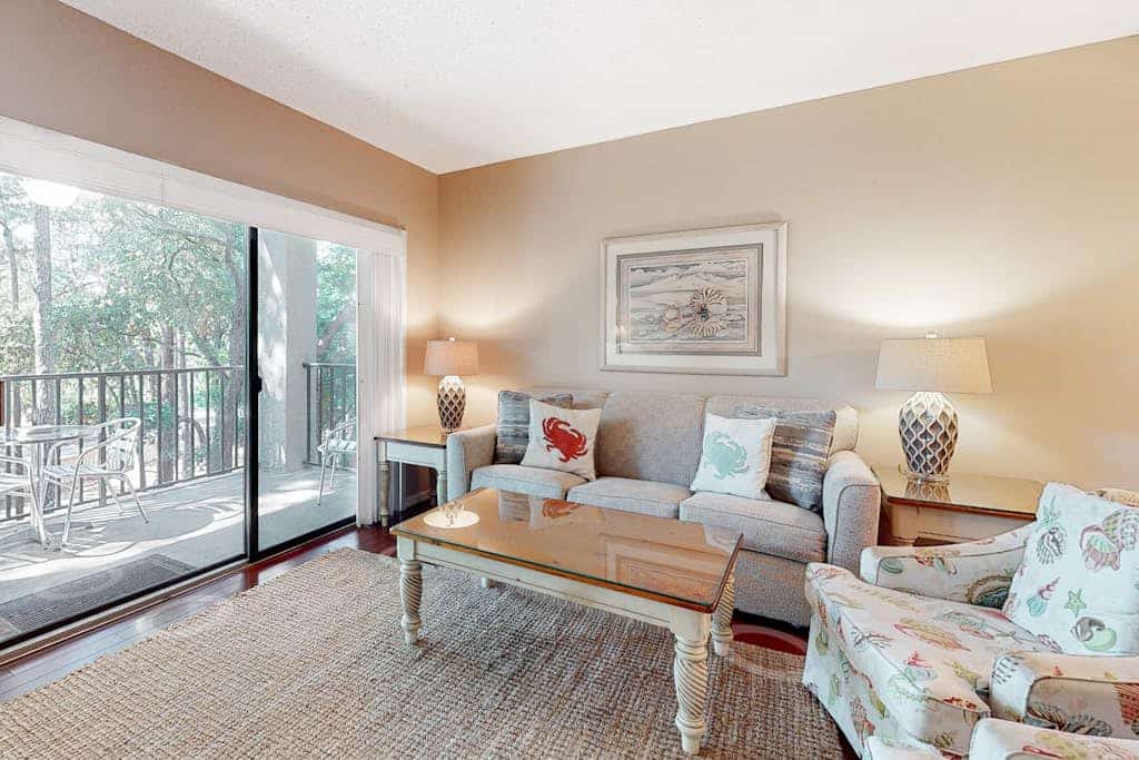 Second-floor condo with balcony, shared outdoor pool, central AC