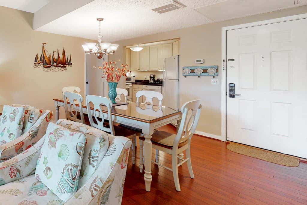 Second-floor condo with balcony, shared outdoor pool, central AC