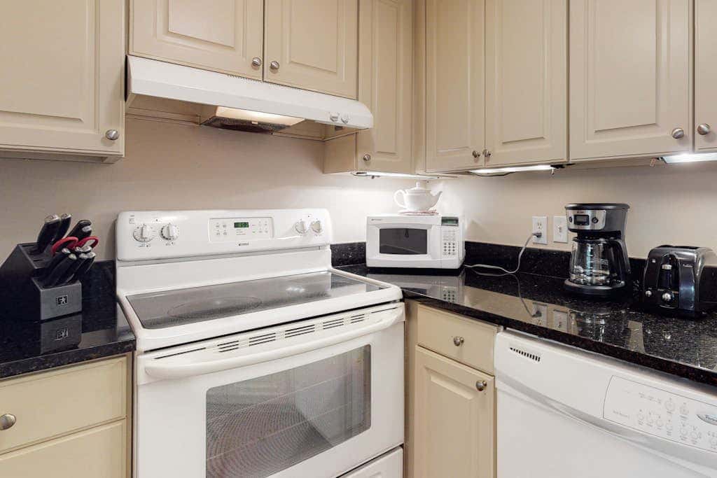 Second-floor condo with balcony, shared outdoor pool, central AC