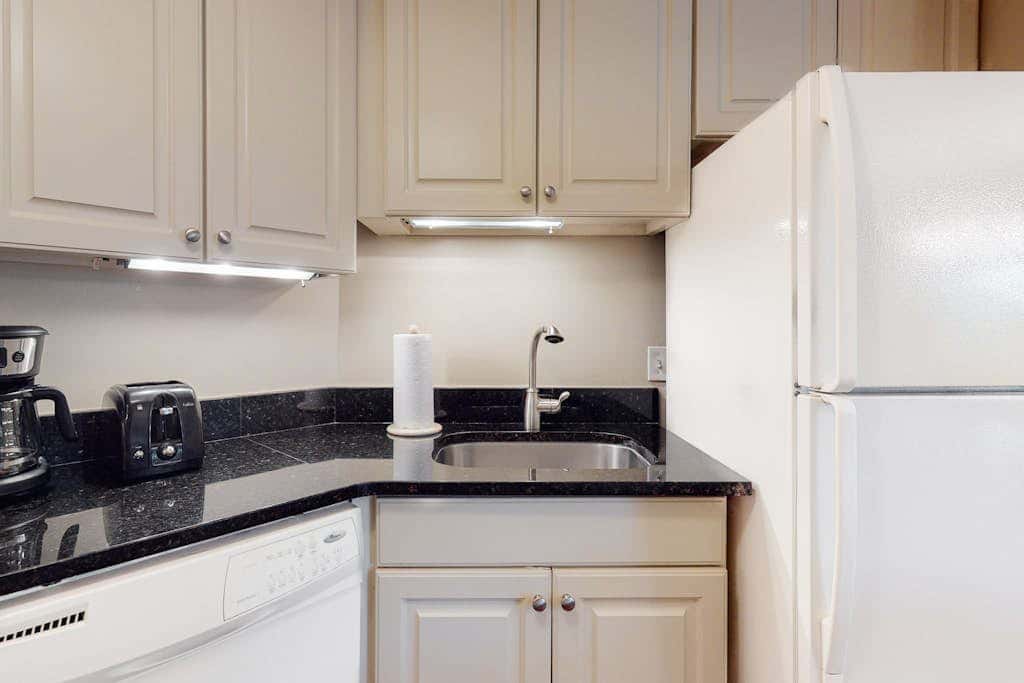 Second-floor condo with balcony, shared outdoor pool, central AC