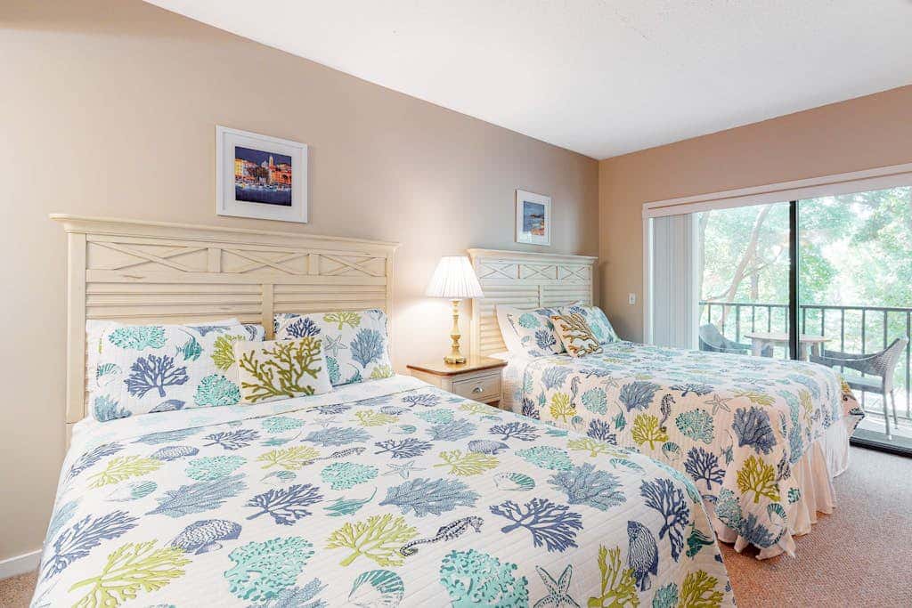 Second-floor condo with balcony, shared outdoor pool, central AC