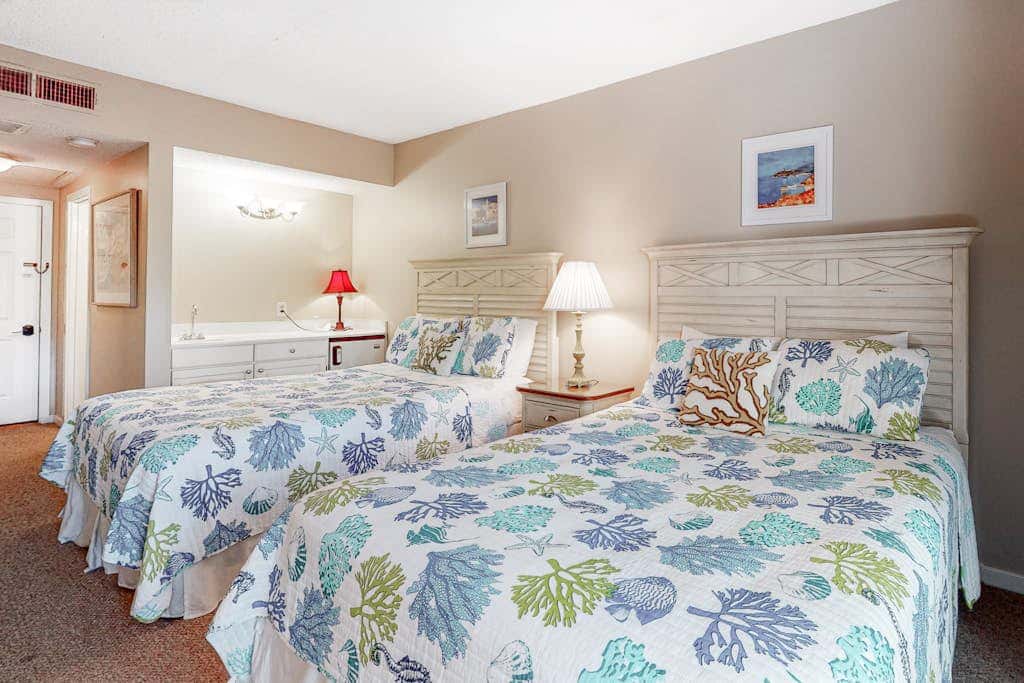 Second-floor condo with balcony, shared outdoor pool, central AC