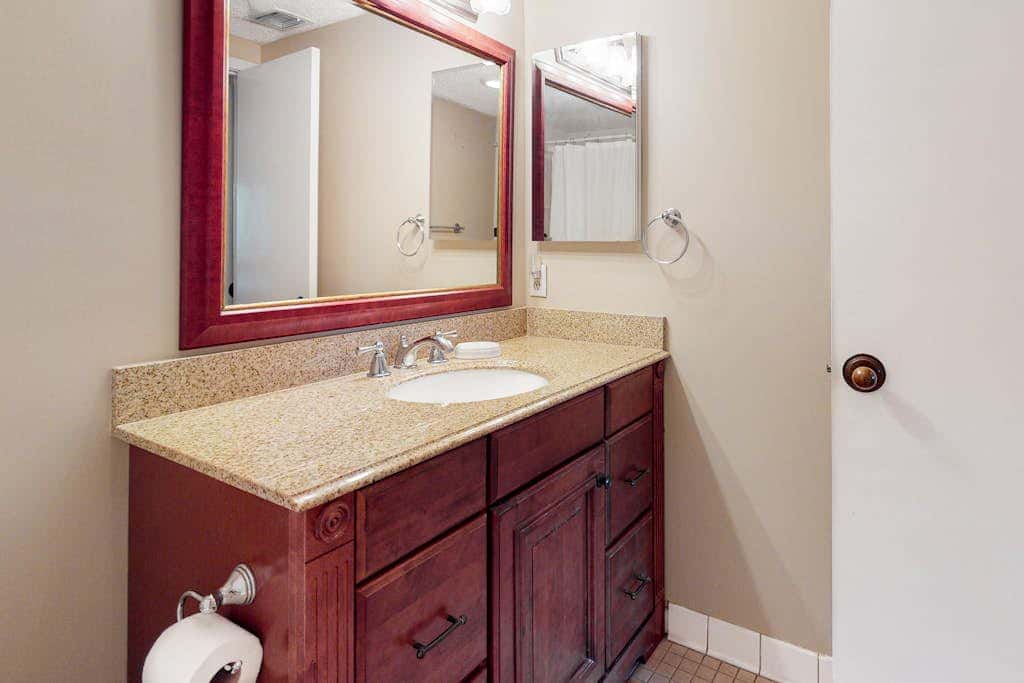 Second-floor condo with balcony, shared outdoor pool, central AC