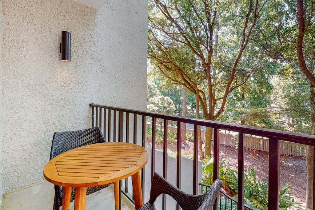 Second-floor condo with balcony, shared outdoor pool, central AC