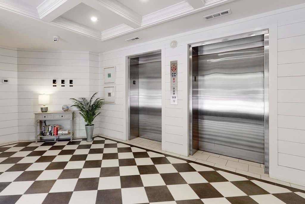 Second-floor condo with balcony, shared outdoor pool, central AC