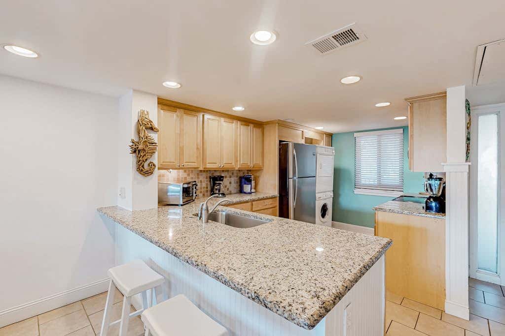 3rd-floor condo with balcony, lagoon views, pools, tennis courts, & beach access