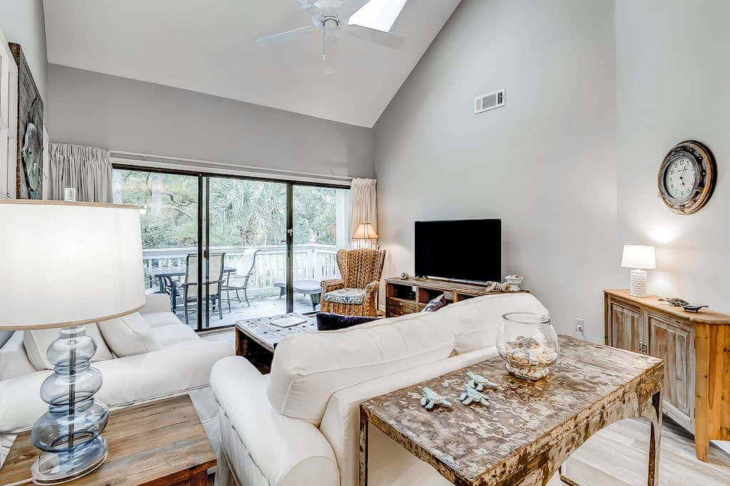 Sun-kissed bliss at Colonnade Club with dual suites, deck, shared pool, hot tub