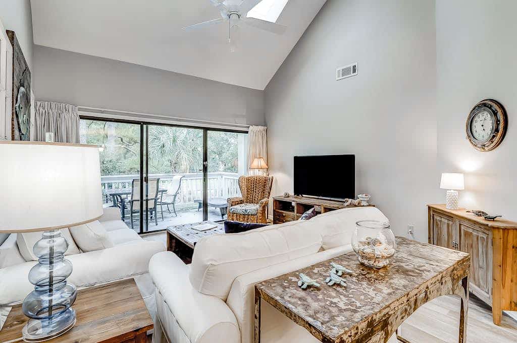 Sun-kissed bliss at Colonnade Club with dual suites, deck, shared pool, hot tub