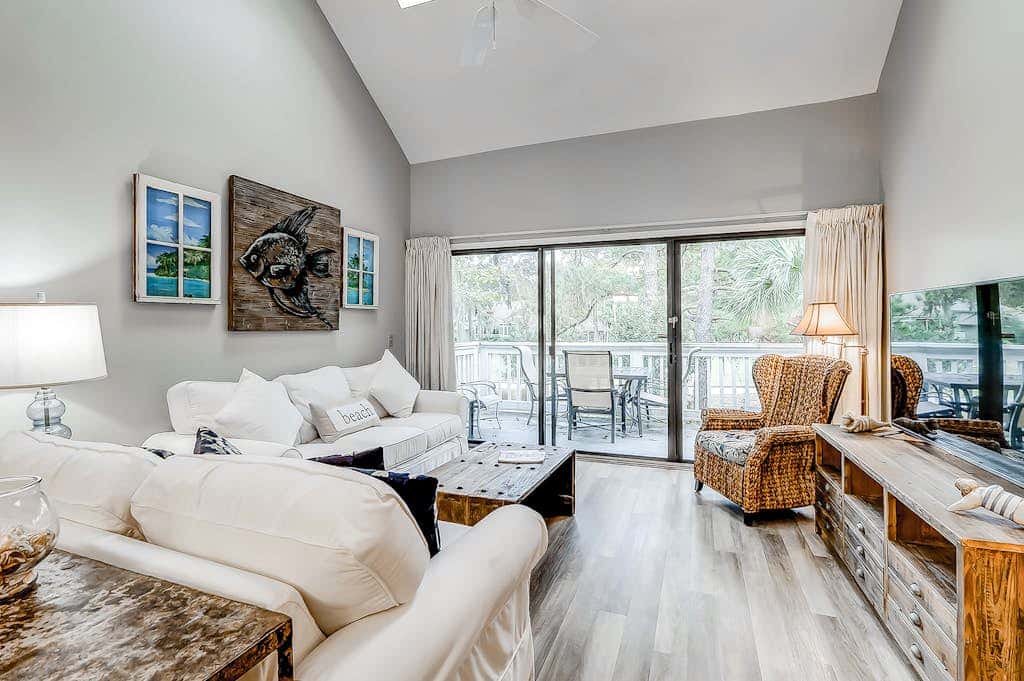 Sun-kissed bliss at Colonnade Club with dual suites, deck, shared pool, hot tub