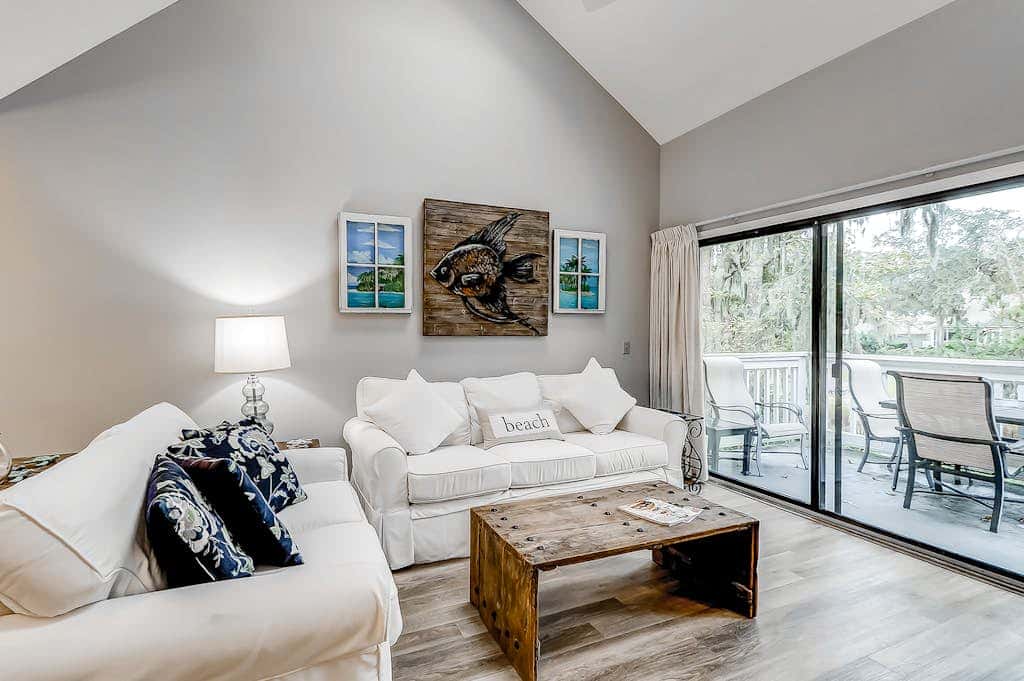 Sun-kissed bliss at Colonnade Club with dual suites, deck, shared pool, hot tub