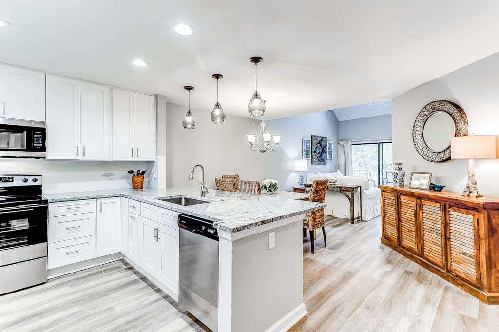 Sun-kissed bliss at Colonnade Club with dual suites, deck, shared pool, hot tub