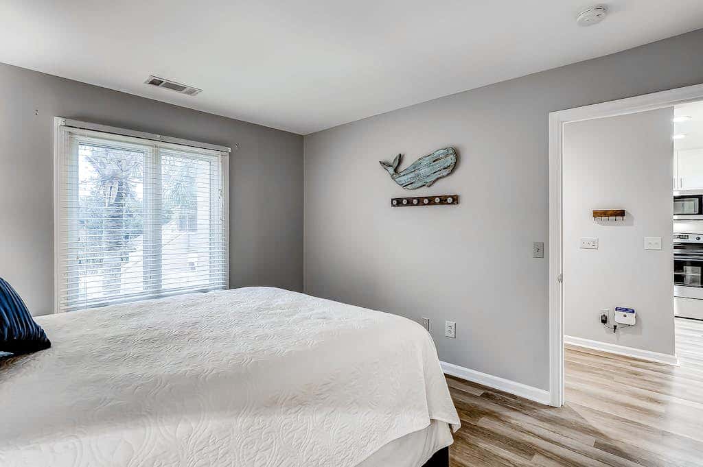 Sun-kissed bliss at Colonnade Club with dual suites, deck, shared pool, hot tub