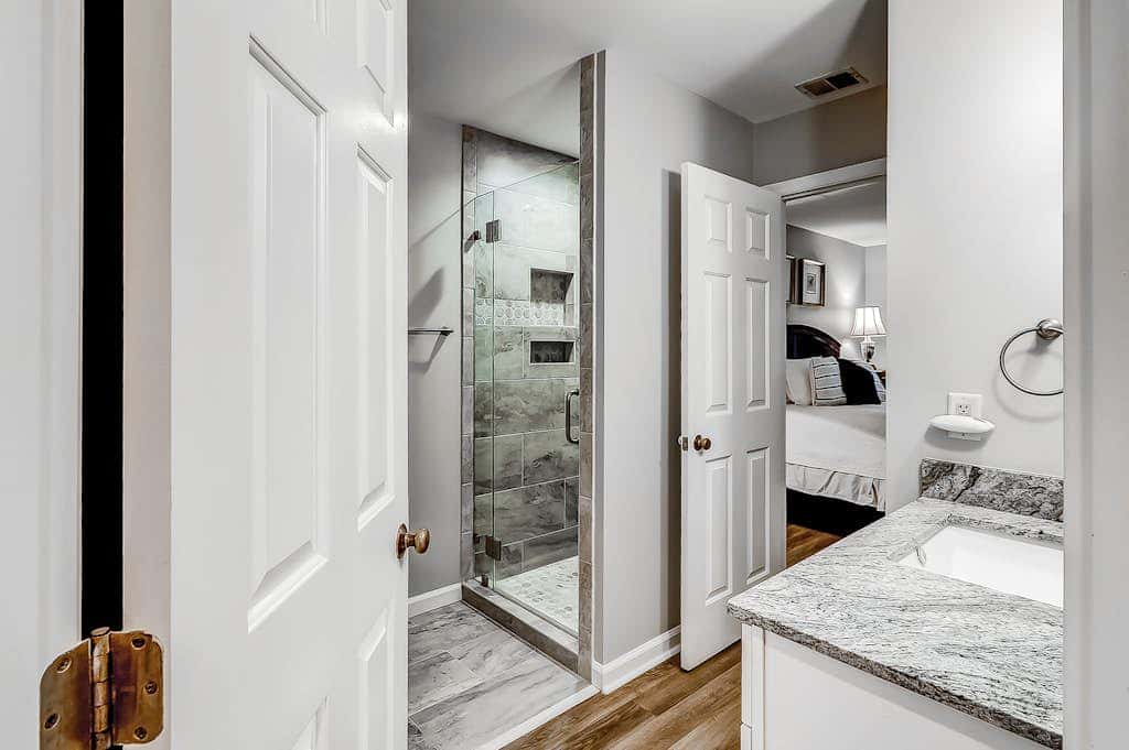 Sun-kissed bliss at Colonnade Club with dual suites, deck, shared pool, hot tub