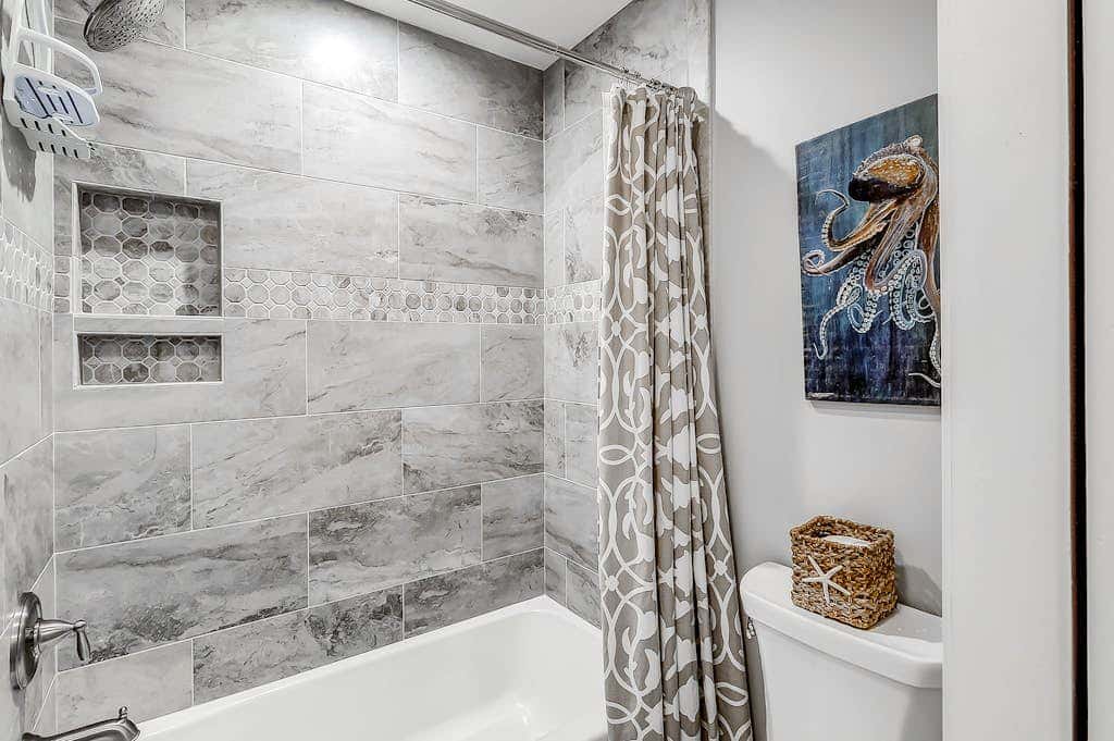 Sun-kissed bliss at Colonnade Club with dual suites, deck, shared pool, hot tub