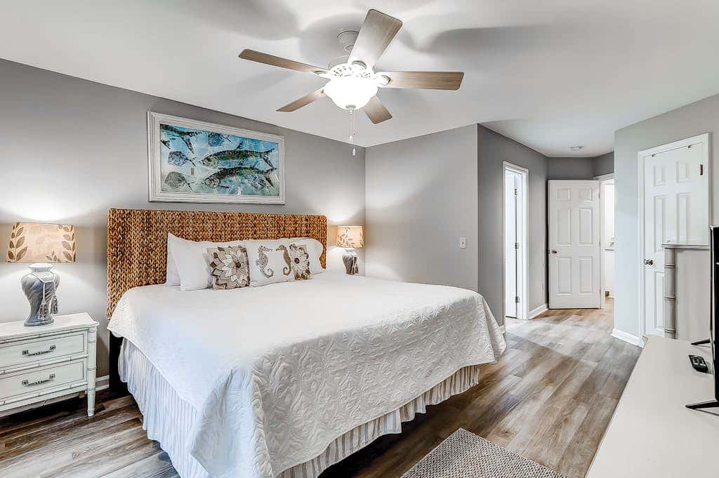Sun-kissed bliss at Colonnade Club with dual suites, deck, shared pool, hot tub