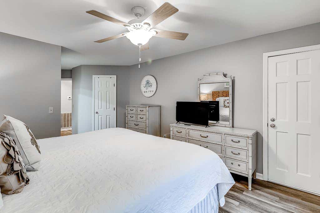 Sun-kissed bliss at Colonnade Club with dual suites, deck, shared pool, hot tub