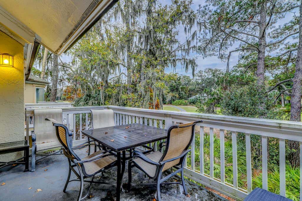 Sun-kissed bliss at Colonnade Club with dual suites, deck, shared pool, hot tub