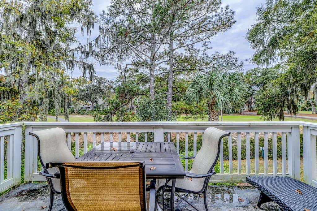 Sun-kissed bliss at Colonnade Club with dual suites, deck, shared pool, hot tub