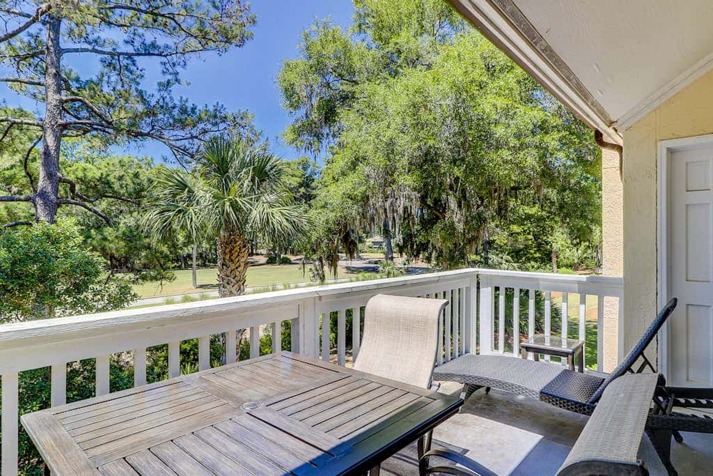 Sun-kissed bliss at Colonnade Club with dual suites, deck, shared pool, hot tub